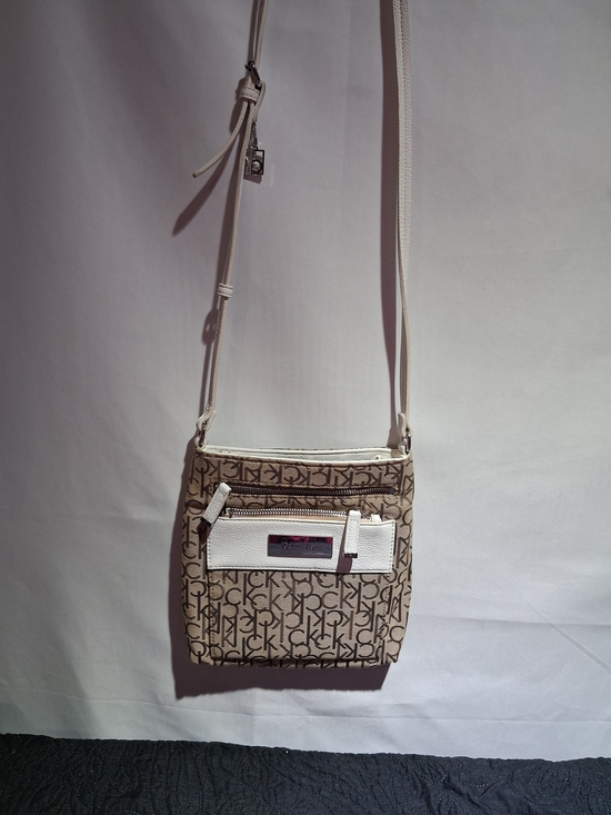Calvin Klein Handbags - Calvin Klein Beige Monogram Crossbody with White Trim